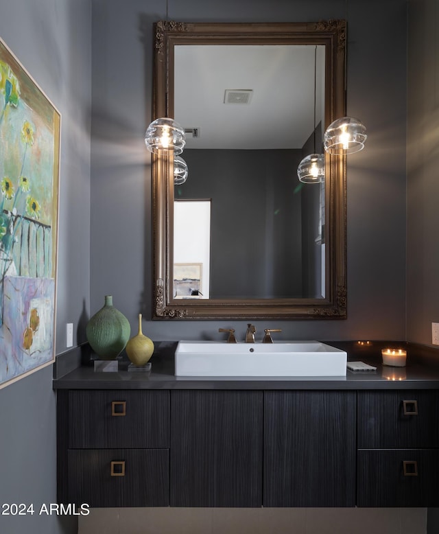 bathroom with visible vents and vanity