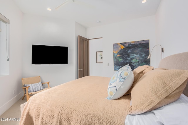 carpeted bedroom featuring recessed lighting and baseboards