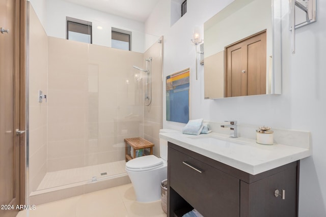 full bath featuring vanity, tile patterned floors, toilet, and a walk in shower