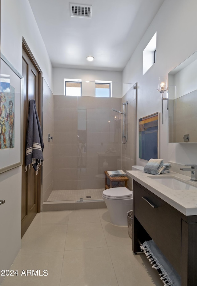 full bath with visible vents, a walk in shower, toilet, and vanity