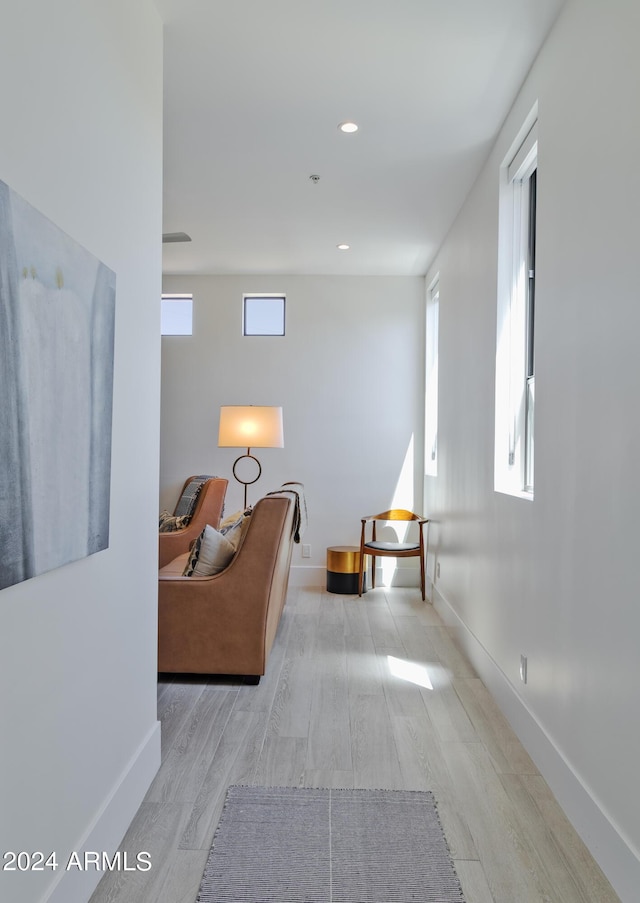 interior space featuring recessed lighting, wood finished floors, and baseboards