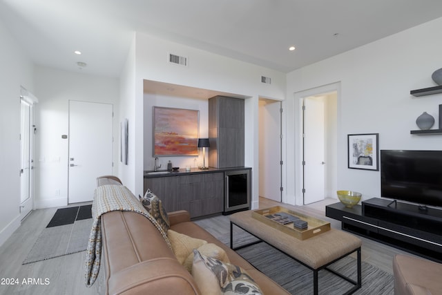 living room with wine cooler, recessed lighting, and visible vents