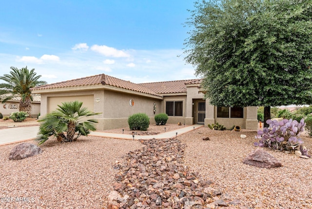 20450 N Shadow Mountain Dr, Surprise, AZ 85374 - mediterranean / spanish-style house with stucco siding, a tiled roof, an attached garage, and concrete driveway
