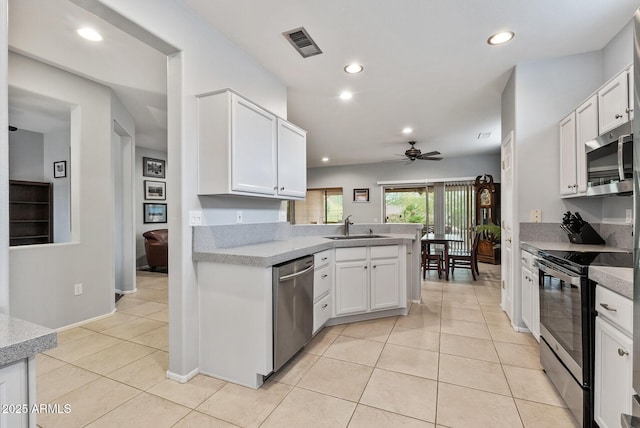 20450 N Shadow Mountain Dr, Surprise, AZ 85374 - kitchen with appliances with stainless steel finishes, a sink, a ceiling fan, recessed lighting, and white cabinets