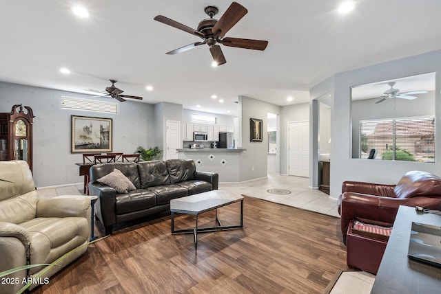 20450 N Shadow Mountain Dr, Surprise, AZ 85374 - living area featuring a ceiling fan, recessed lighting, light wood finished floors, and baseboards