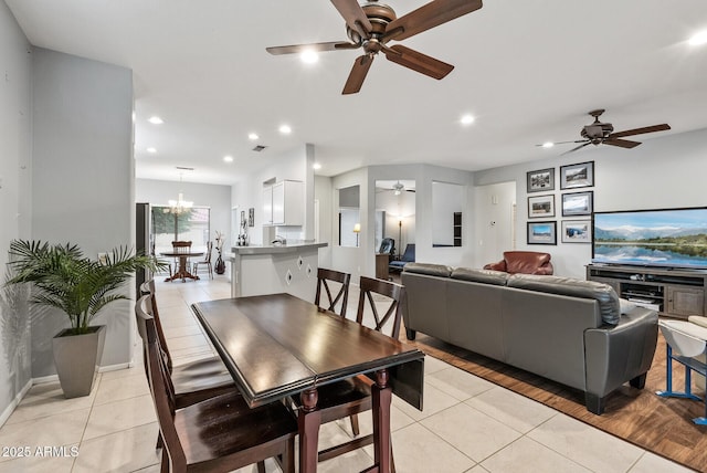 20450 N Shadow Mountain Dr, Surprise, AZ 85374 - dining room featuring a ceiling fan, light tile patterned floors, recessed lighting, baseboards, and a chandelier