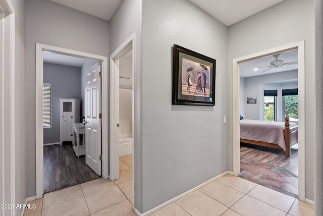20450 N Shadow Mountain Dr, Surprise, AZ 85374 - hall with light tile patterned floors and baseboards