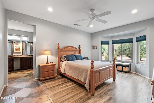 20450 N Shadow Mountain Dr, Surprise, AZ 85374 - bedroom featuring recessed lighting, baseboards, connected bathroom, a ceiling fan, and light wood finished floors