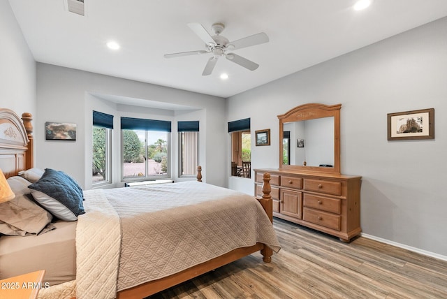 20450 N Shadow Mountain Dr, Surprise, AZ 85374 - bedroom with light wood-style flooring, recessed lighting, baseboards, and a ceiling fan