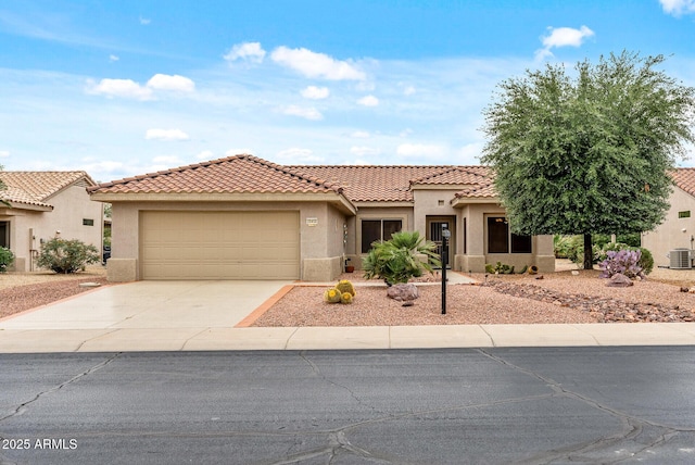 20450 N Shadow Mountain Dr, Surprise, AZ 85374 - view of front of house with driveway, stucco siding, an attached garage, and a tile roof
