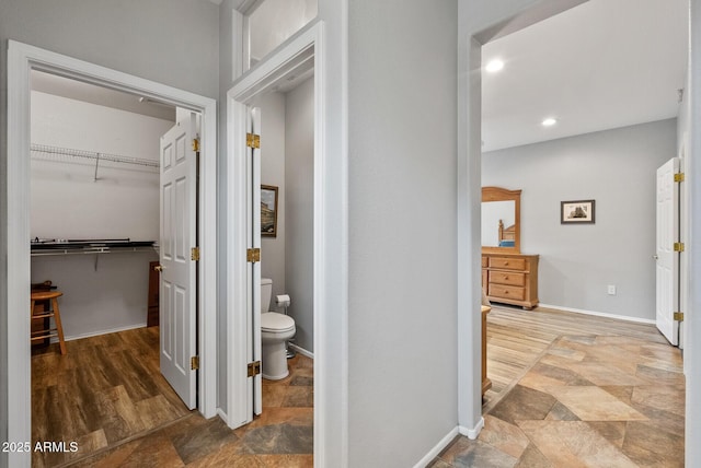 20450 N Shadow Mountain Dr, Surprise, AZ 85374 - corridor featuring stone finish floors, recessed lighting, and baseboards