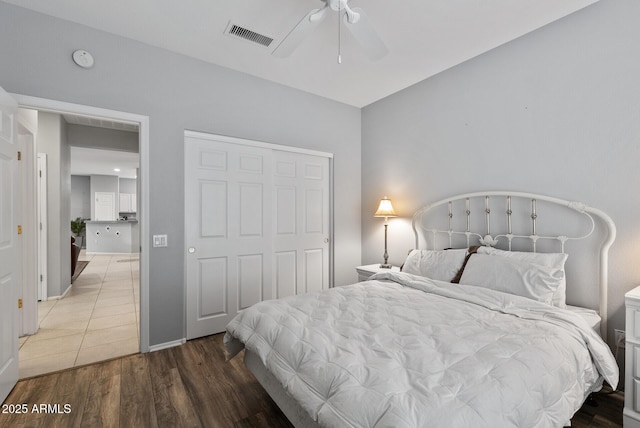 20450 N Shadow Mountain Dr, Surprise, AZ 85374 - bedroom with wood finished floors, a closet, and a ceiling fan