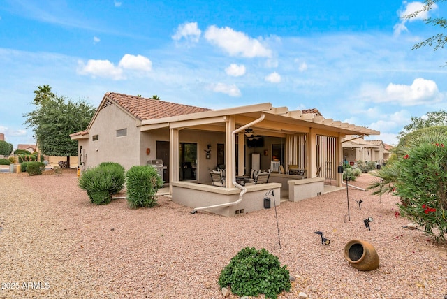 20450 N Shadow Mountain Dr, Surprise, AZ 85374 - back of property featuring ceiling fan, a patio, a tile roof, stucco siding, and outdoor lounge area