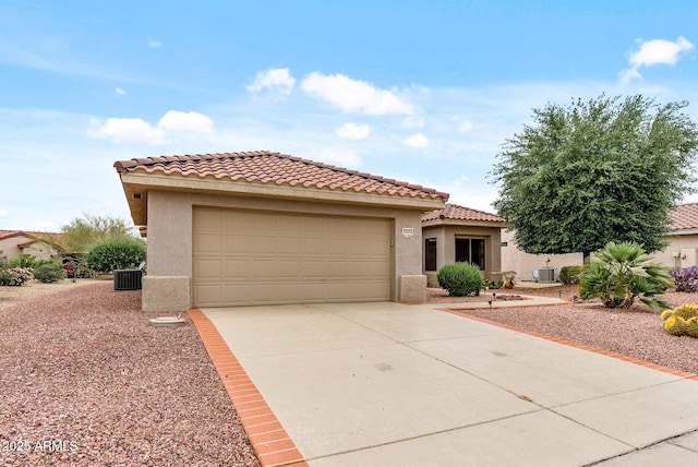 20450 N Shadow Mountain Dr, Surprise, AZ 85374 - mediterranean / spanish-style home with stucco siding, concrete driveway, a tiled roof, an attached garage, and central AC unit