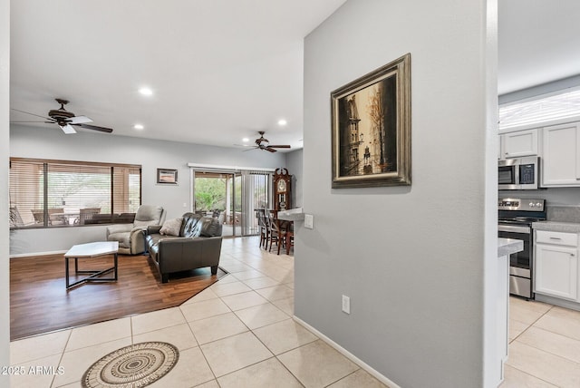 20450 N Shadow Mountain Dr, Surprise, AZ 85374 - living area with a ceiling fan, light tile patterned floors, recessed lighting, and baseboards