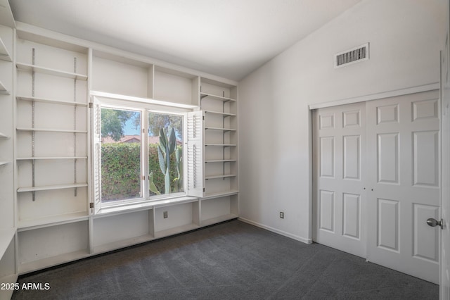 1226 E Greenway Cir, Mesa, AZ 85203 - unfurnished bedroom featuring dark colored carpet, baseboards, and a closet