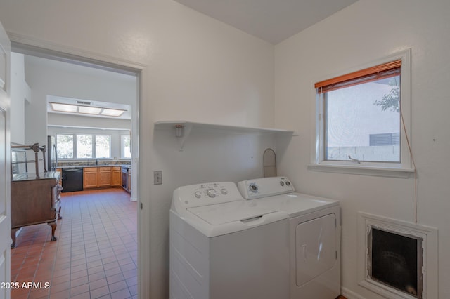 1226 E Greenway Cir, Mesa, AZ 85203 - washroom with washer and dryer and light tile patterned floors