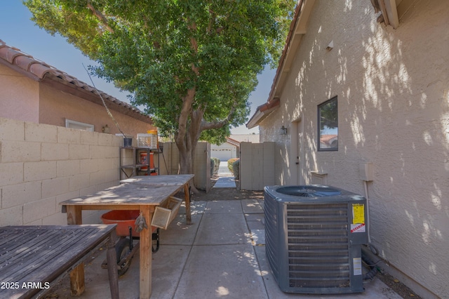 1226 E Greenway Cir, Mesa, AZ 85203 - view of patio with central air condition unit, a fenced backyard, and outdoor dining space