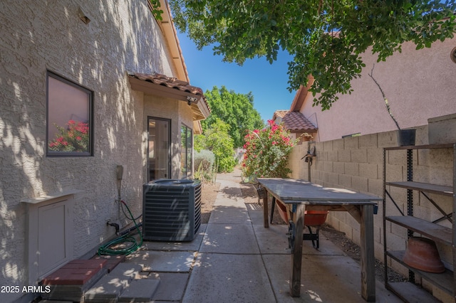 1226 E Greenway Cir, Mesa, AZ 85203 - view of patio / terrace featuring central AC and fence