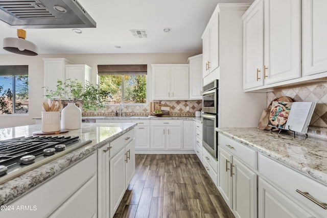 kitchen featuring ventilation hood, white cabinets, dark hardwood / wood-style floors, and a healthy amount of sunlight