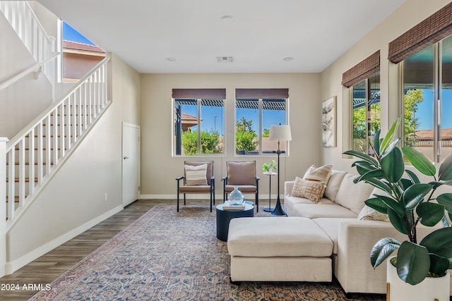 living room with plenty of natural light and hardwood / wood-style floors