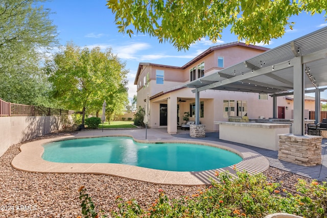 view of swimming pool featuring a patio area, area for grilling, and a pergola