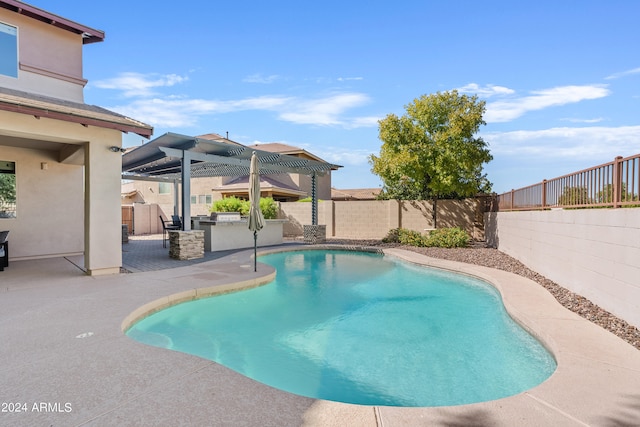 view of pool with a pergola and a patio