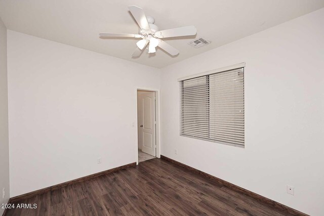 4321 E Desert Sky Ct, Cave Creek, AZ 85331 - unfurnished room featuring baseboards, visible vents, a ceiling fan, and dark wood-style flooring