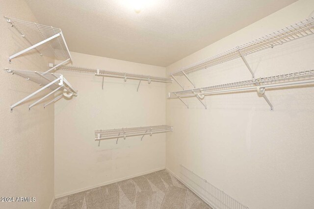 4321 E Desert Sky Ct, Cave Creek, AZ 85331 - unfurnished room with carpet flooring, crown molding, a ceiling fan, visible vents, and baseboards
