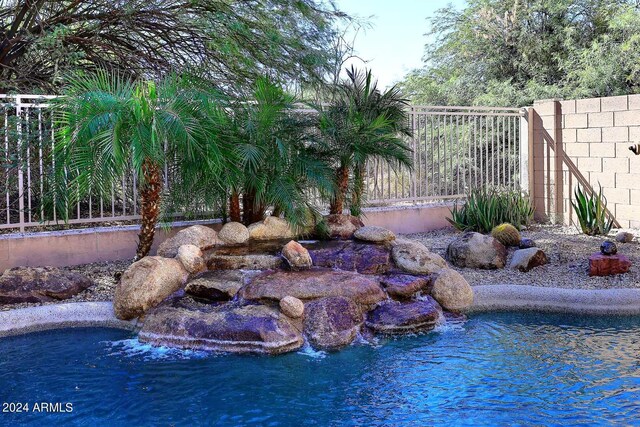 4321 E Desert Sky Ct, Cave Creek, AZ 85331 - rear view of house with fence, stucco siding, a jacuzzi, and a patio area