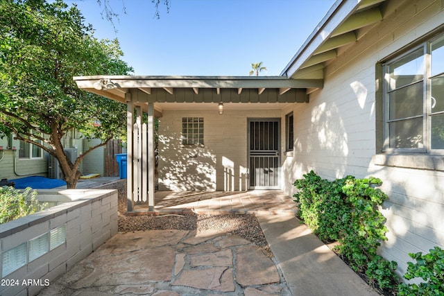 doorway to property featuring a patio