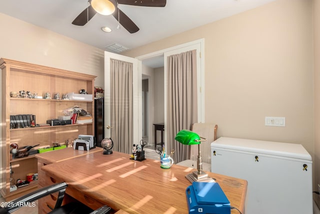 office featuring ceiling fan and visible vents