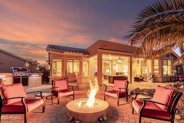 view of patio / terrace featuring a fire pit, grilling area, and area for grilling
