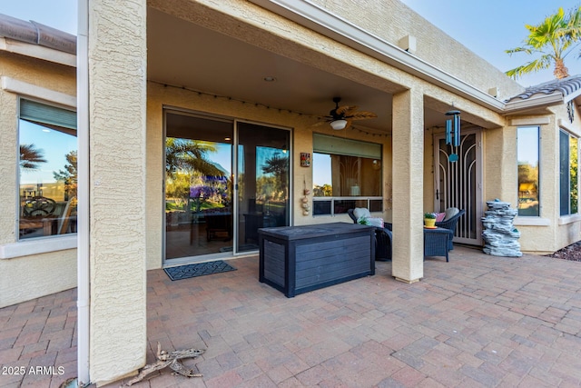 view of patio featuring ceiling fan