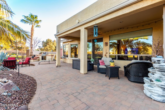 view of patio / terrace featuring fence, an outdoor living space, and area for grilling