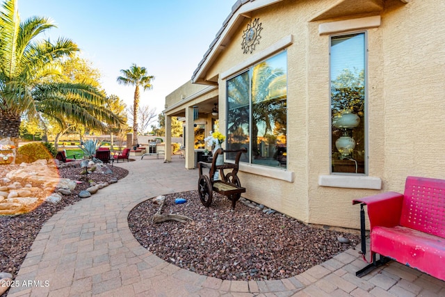 view of patio / terrace with fence and a ceiling fan
