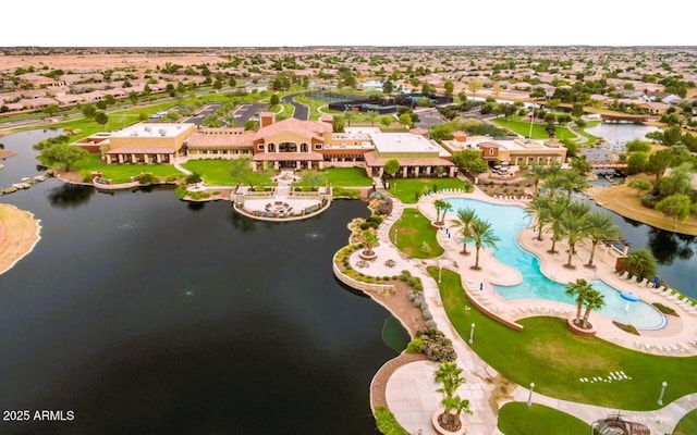 drone / aerial view featuring a water view and a residential view
