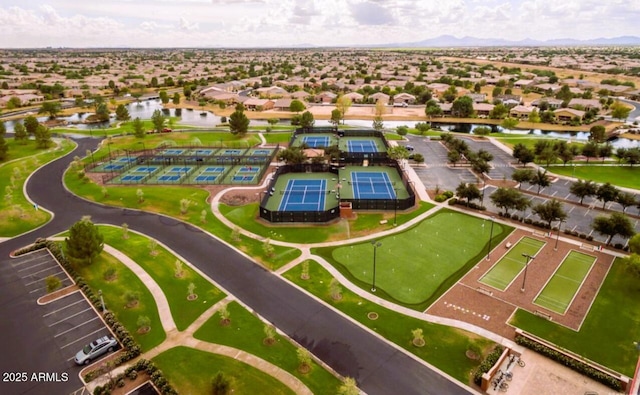 birds eye view of property with a water view and a residential view
