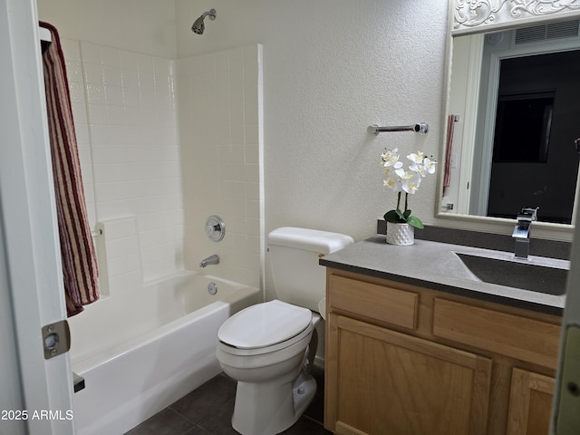 full bathroom featuring tile patterned flooring, vanity,  shower combination, and toilet