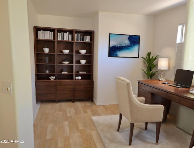 office space with light hardwood / wood-style flooring