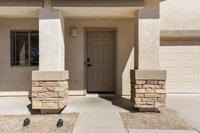 1612 E Desert Rose Trl, San Tan Valley, AZ 85143 - view of exterior entry with a garage and stucco siding
