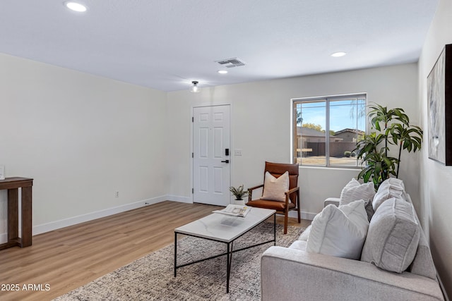 1612 E Desert Rose Trl, San Tan Valley, AZ 85143 - living room with recessed lighting, visible vents, baseboards, and light wood-style flooring