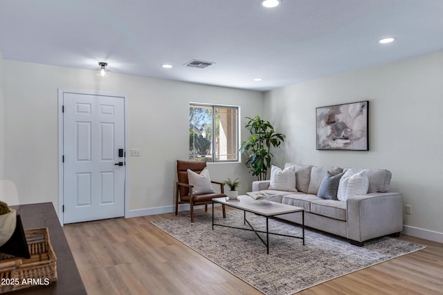 1612 E Desert Rose Trl, San Tan Valley, AZ 85143 - living room with visible vents, baseboards, recessed lighting, and light wood-style floors