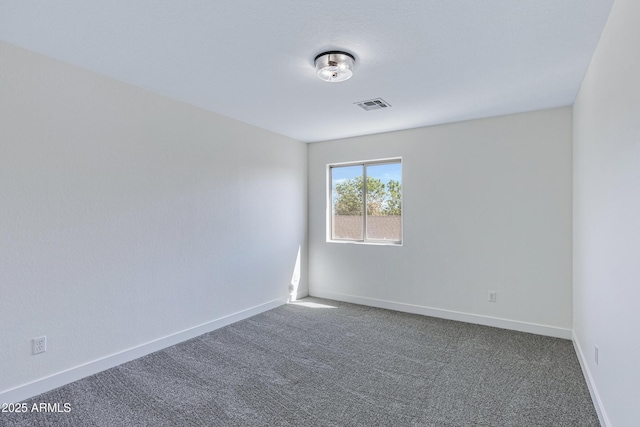 1612 E Desert Rose Trl, San Tan Valley, AZ 85143 - empty room with dark colored carpet, visible vents, and baseboards