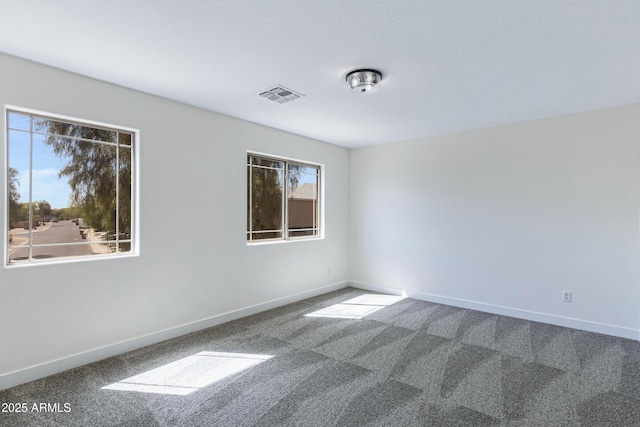 1612 E Desert Rose Trl, San Tan Valley, AZ 85143 - carpeted spare room featuring visible vents and baseboards