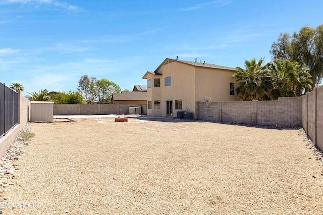 1612 E Desert Rose Trl, San Tan Valley, AZ 85143 - back of property with a patio area, a fenced backyard, and stucco siding