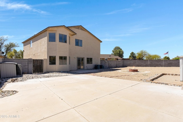 1612 E Desert Rose Trl, San Tan Valley, AZ 85143 - back of property with cooling unit, a patio, stucco siding, a gate, and fence private yard