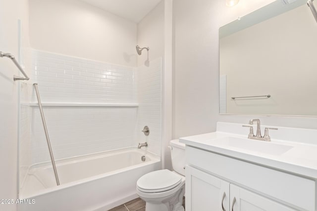 full bathroom featuring vanity, washtub / shower combination, and toilet