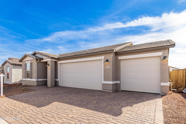 ranch-style home featuring a garage