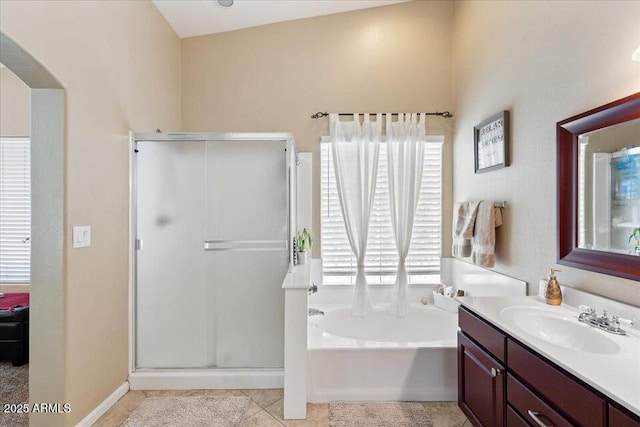 bathroom with vanity, tile patterned floors, and separate shower and tub